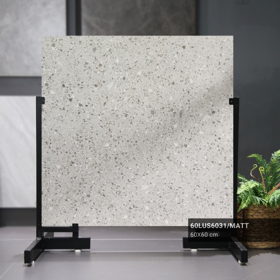 Mẫu gạch terrazzo màu xám sáng với các mảng đá nhỏ, khi được ốp trong toilet mang lại vẻ đẹp sạch sẽ, hiện đại.