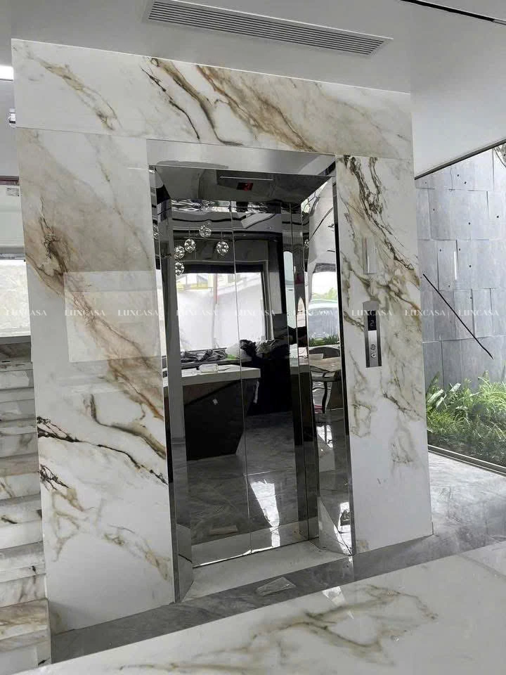 Đá nung kết Calacatta Gold ốp thang máy